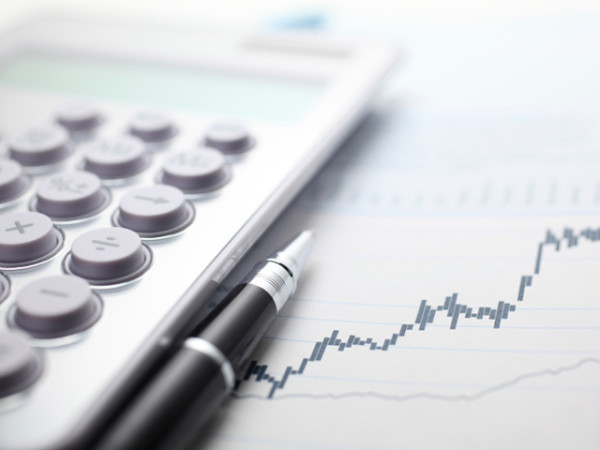 Picture Of A Calculator And Graph Being Used By A FINRA Attorney - Fishman Legal